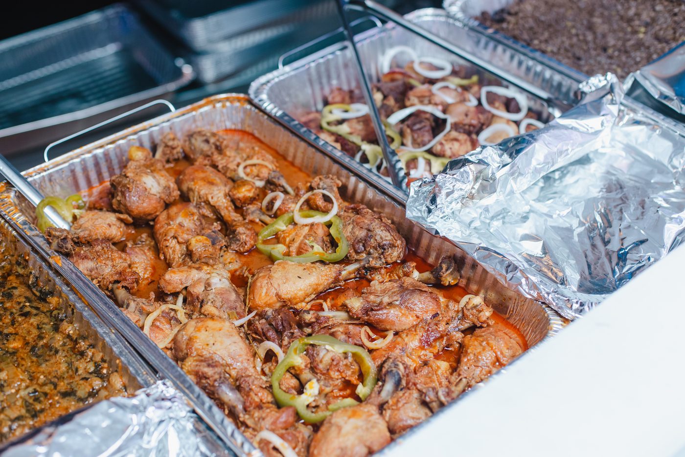 Catering trays lined up for service during an event at Stem & Vine in Baltimore