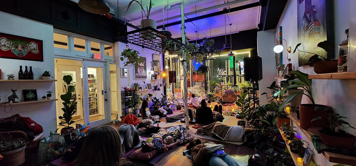 Guests filling the lounge under colored lights during an evening event at Stem & Vine, Baltimore