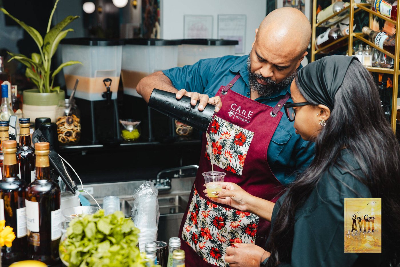 Two Stem & Vine bartenders mixing drinks behind the bar at a Baltimore event