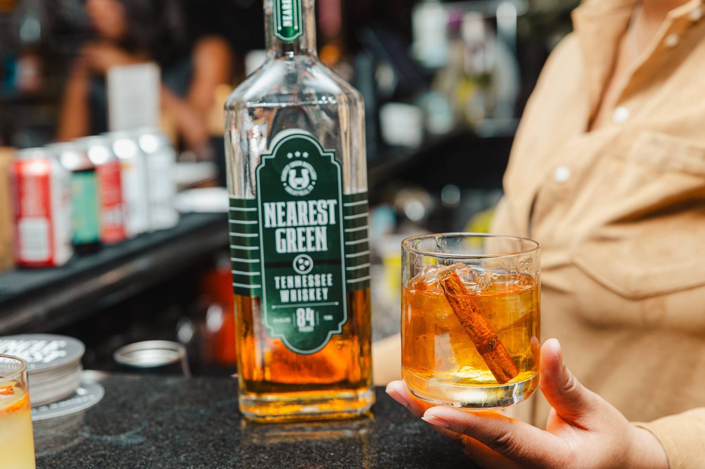 Old fashioned cocktail beside a Black-owned whiskey bottle poured by Stem & Vine in Baltimore