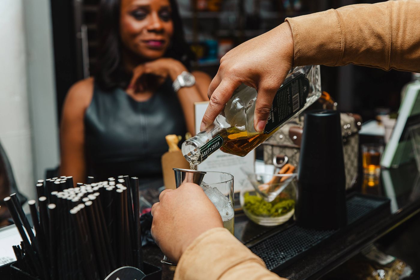 Cocktail being poured at a Stem & Vine whiskey event in Baltimore