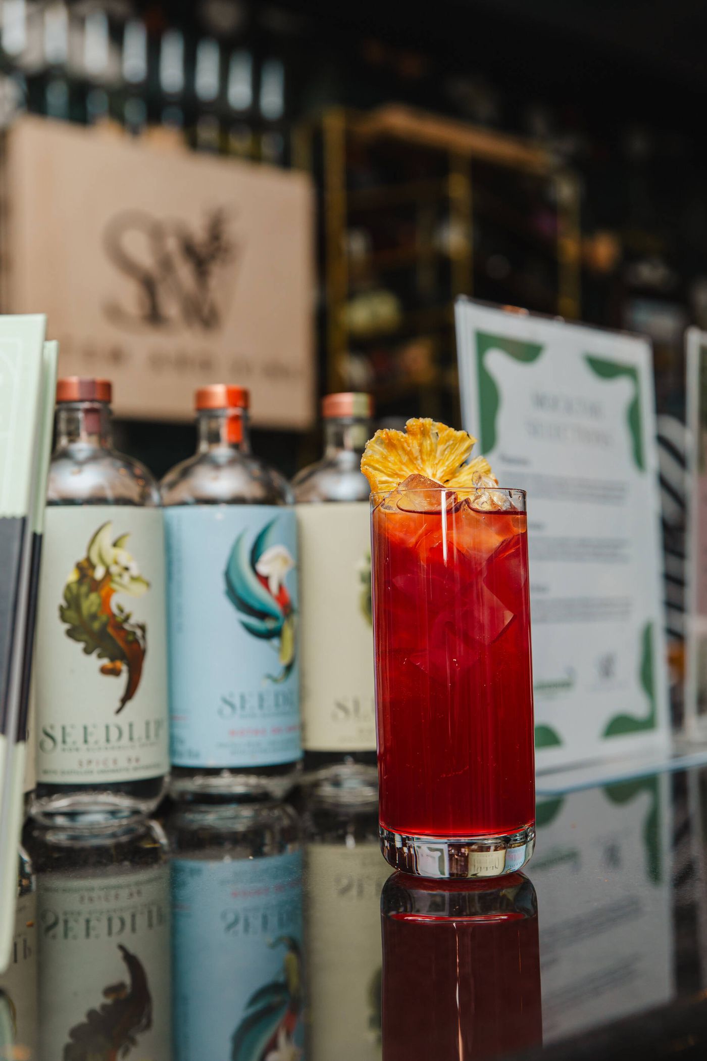 Craft spirits and a cocktail on the bar at Stem & Vine in downtown Baltimore