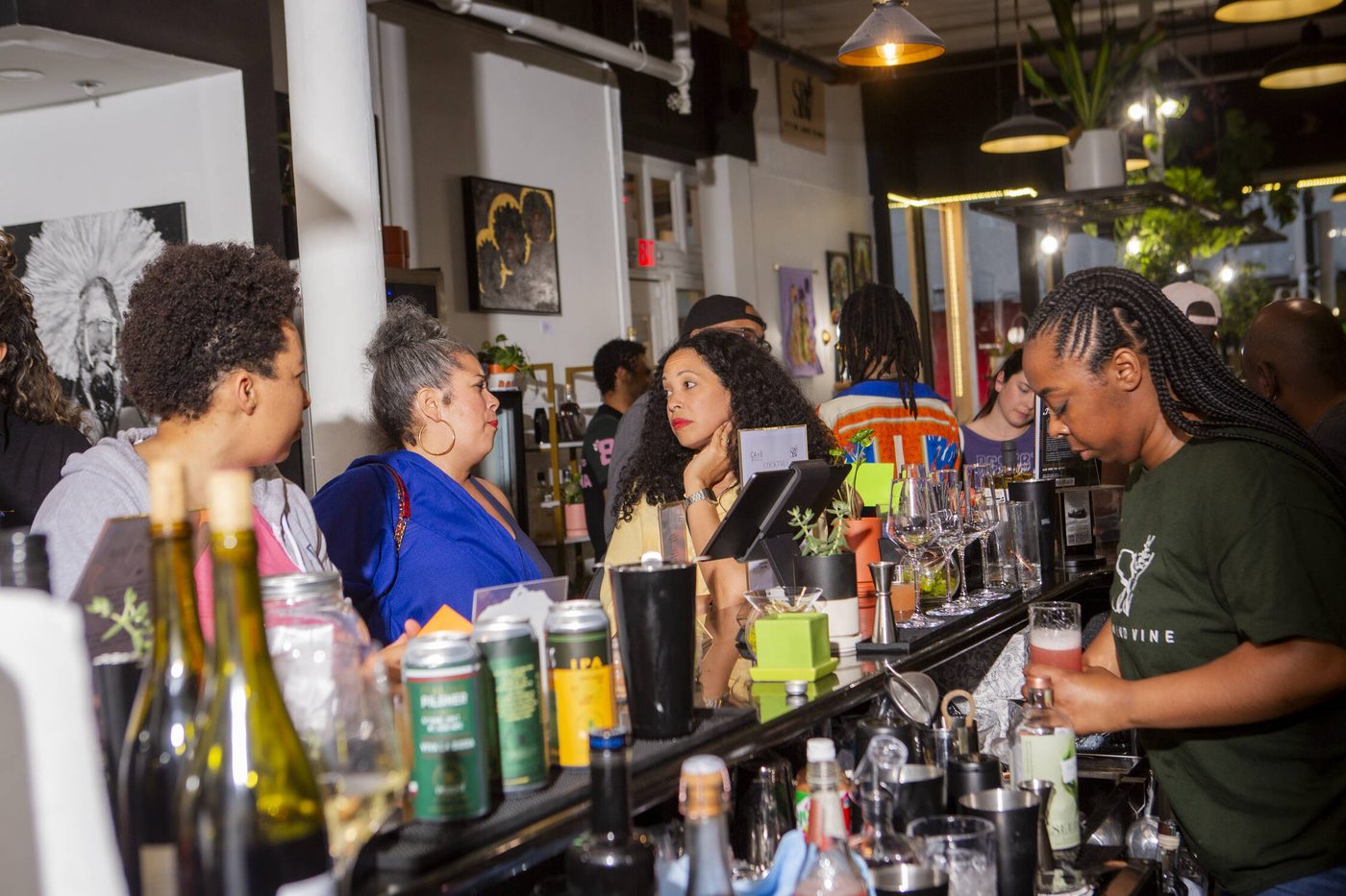 Guests gathered along the bar during a private event at Stem & Vine, Baltimore