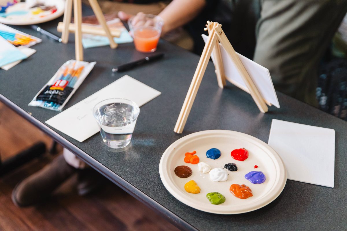 Paint palette and small easel set out for a sip and paint session at Stem & Vine, Baltimore