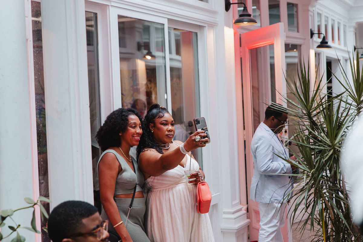 Wedding photos being taken in the courtyard at Stem & Vine, Baltimore
